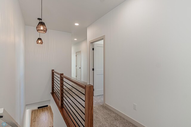 8820 Northern Lights Ave, Fargo, ND 58047 - corridor with an upstairs landing, recessed lighting, baseboards, and light colored carpet