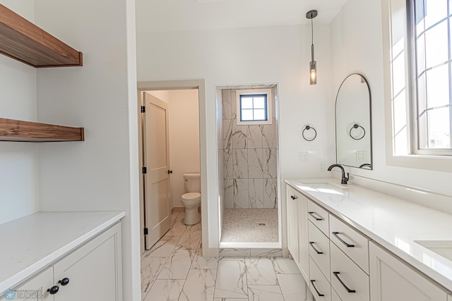 8820 Northern Lights Ave, Fargo, ND 58047 - full bath featuring marble look tile flooring, a tile shower, double vanity, and toilet