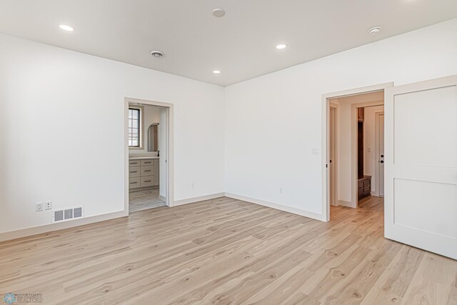 8820 Northern Lights Ave, Fargo, ND 58047 - empty room featuring light wood-style floors, baseboards, recessed lighting, and a smoke detector