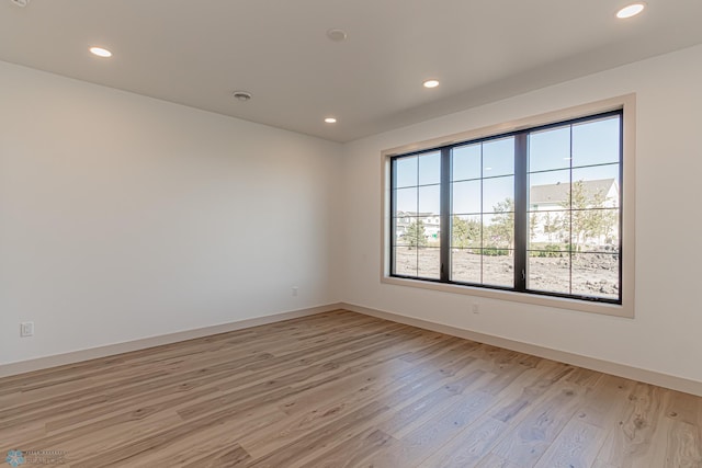 8820 Northern Lights Ave, Fargo, ND 58047 - empty room featuring light wood-style floors, recessed lighting, and baseboards