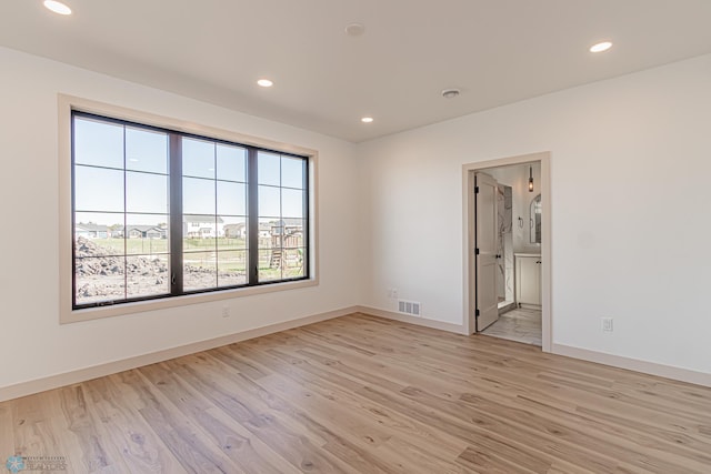 8820 Northern Lights Ave, Fargo, ND 58047 - unfurnished room with light wood-type flooring, recessed lighting, and baseboards