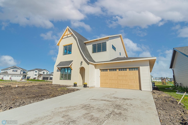 8820 Northern Lights Ave, Fargo, ND 58047 - view of front facade with driveway, a shingled roof, and an attached garage