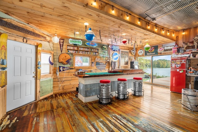 2132 295th Ave, Luck, WI 54853 - bar area featuring hardwood / wood-style floors and wooden walls