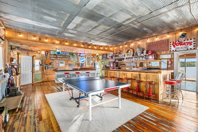 2132 295th Ave, Luck, WI 54853 - game room featuring wood-type flooring, wooden walls, and a dry bar