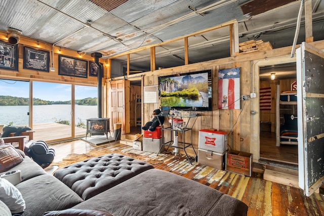 2132 295th Ave, Luck, WI 54853 - living area with a wood stove, wooden walls, and wood-type flooring