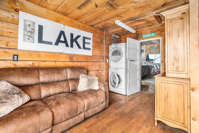 2132 295th Ave, Luck, WI 54853 - laundry room with stacked washer and clothes dryer, wood ceiling, hardwood / wood-style flooring, and wooden walls
