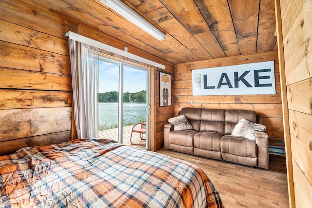 2132 295th Ave, Luck, WI 54853 - bedroom with access to outside, hardwood / wood-style floors, wooden walls, and wooden ceiling