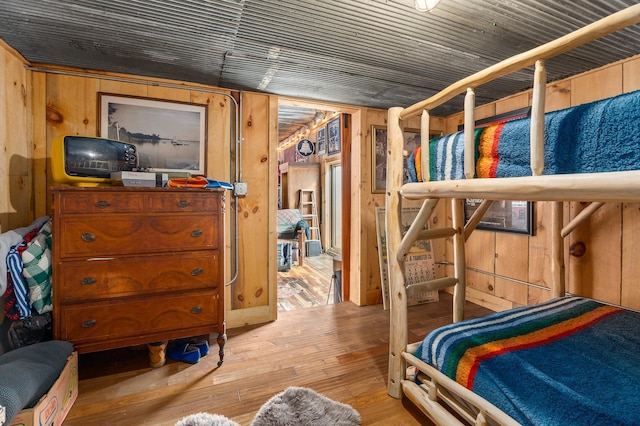 2132 295th Ave, Luck, WI 54853 - bedroom featuring hardwood / wood-style flooring and wood walls