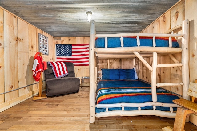 2132 295th Ave, Luck, WI 54853 - bedroom with wood-type flooring and wood walls
