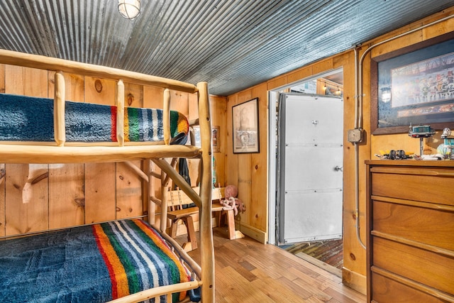 2132 295th Ave, Luck, WI 54853 - bedroom featuring hardwood / wood-style floors and wood walls