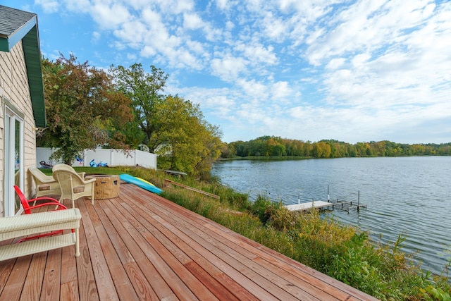 2132 295th Ave, Luck, WI 54853 - wooden terrace with a water view, fence, and an outdoor fire pit