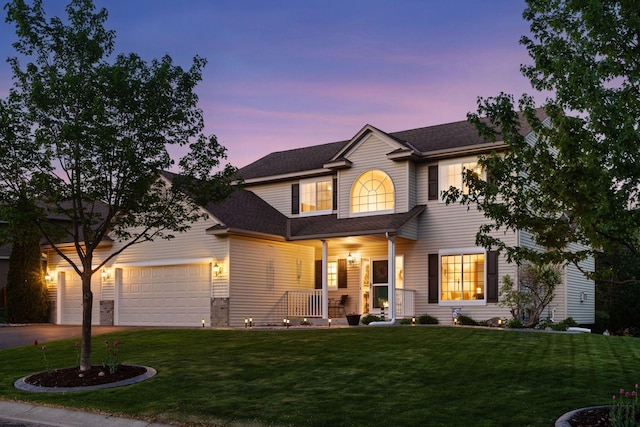 2011 Silver St, Waconia, MN 55387 - traditional home featuring a porch, a garage, a yard, asphalt driveway, and a shingled roof