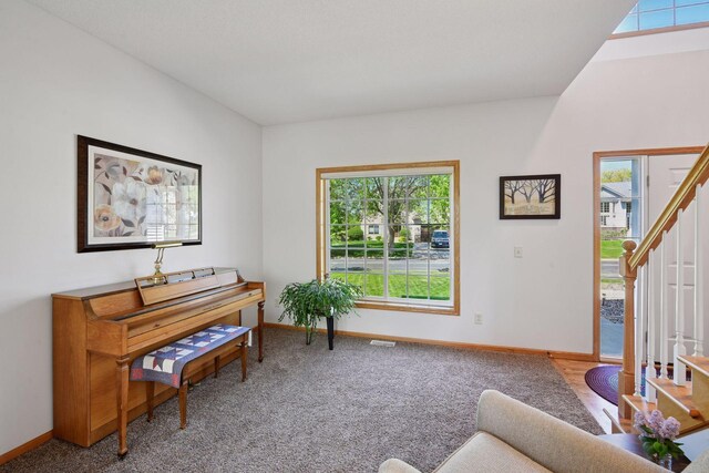 2011 Silver St, Waconia, MN 55387 - living area featuring stairs, baseboards, and healthy amount of natural light