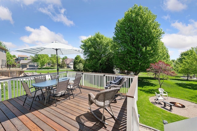 2011 Silver St, Waconia, MN 55387 - wooden deck with an outdoor fire pit, outdoor dining space, and a lawn