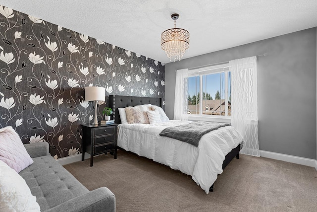 bedroom featuring carpet flooring, a chandelier, baseboards, and wallpapered walls