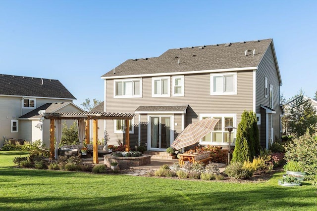 back of property with a pergola, a patio area, a yard, and roof with shingles