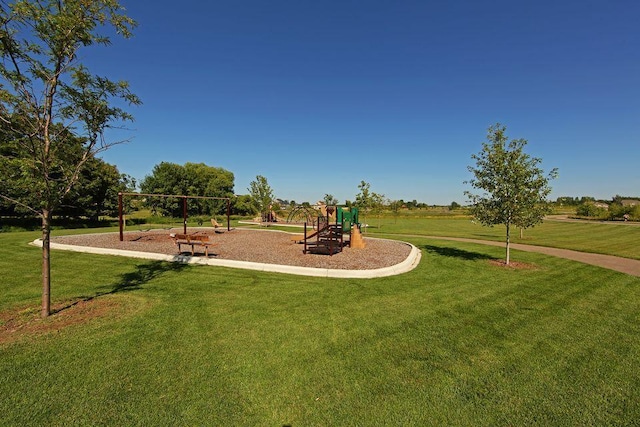 community play area with a lawn