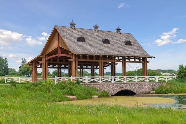 view of home's community featuring fence