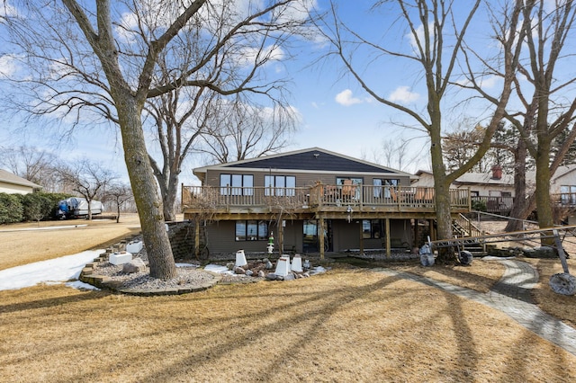 1683 Hansack Ave NE, Saint Michael, MN 55376 - rear view of property featuring a wooden deck, stairs, and a lawn
