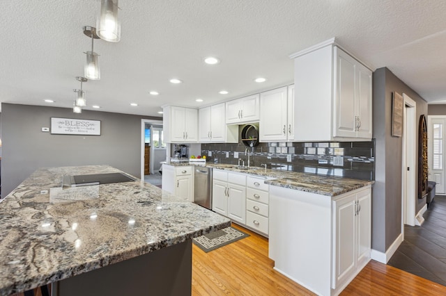 1683 Hansack Ave NE, Saint Michael, MN 55376 - kitchen with dishwasher, a textured ceiling, white cabinets, backsplash, and light wood-style flooring