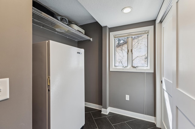 1683 Hansack Ave NE, Saint Michael, MN 55376 - clothes washing area featuring baseboards and dark tile patterned flooring