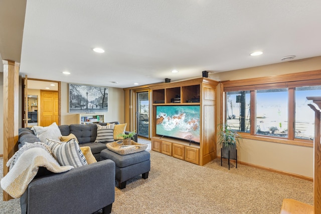 1683 Hansack Ave NE, Saint Michael, MN 55376 - living area with light colored carpet, recessed lighting, baseboards, and decorative columns