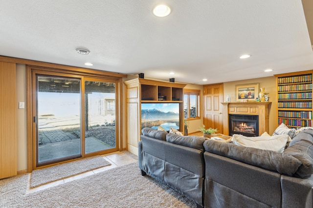 1683 Hansack Ave NE, Saint Michael, MN 55376 - living room with a glass covered fireplace, recessed lighting, and light tile patterned flooring