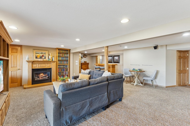 1683 Hansack Ave NE, Saint Michael, MN 55376 - living room featuring carpet floors, a glass covered fireplace, recessed lighting, and baseboards