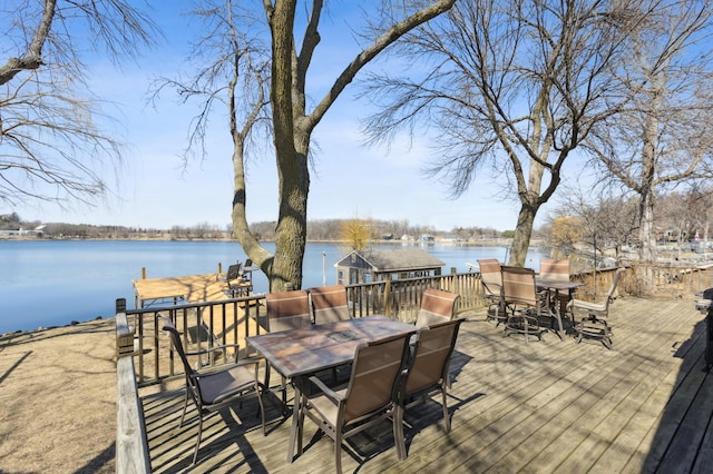 1683 Hansack Ave NE, Saint Michael, MN 55376 - wooden deck with outdoor dining space and a water view