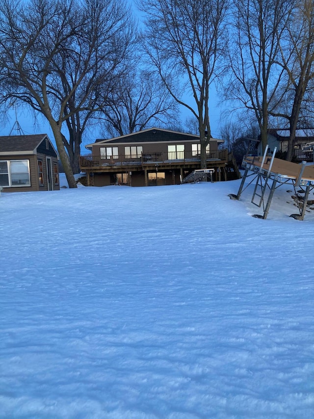 1683 Hansack Ave NE, Saint Michael, MN 55376 - snowy yard featuring a wooden deck and an outbuilding