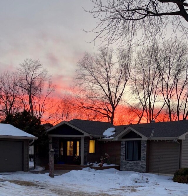 1683 Hansack Ave NE, Saint Michael, MN 55376 - ranch-style house with a porch, stone siding, and a garage