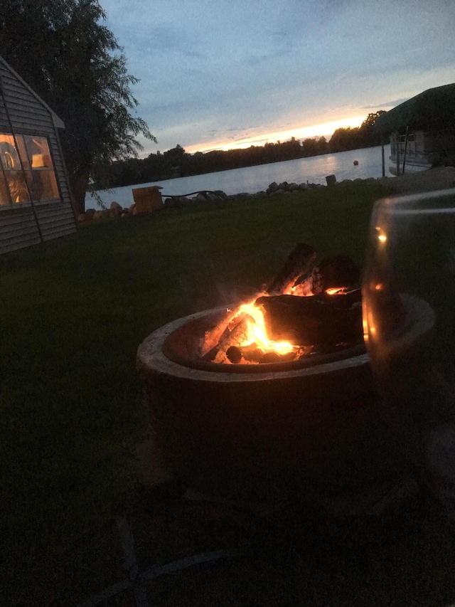 1683 Hansack Ave NE, Saint Michael, MN 55376 - yard at dusk featuring a fire pit and a water view