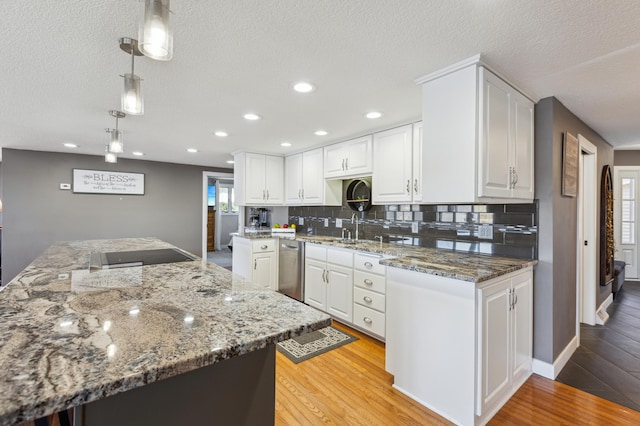 1683 Hansack Ave NE, Saint Michael, MN 55376 - kitchen with dishwasher, a textured ceiling, white cabinetry, tasteful backsplash, and light wood-type flooring