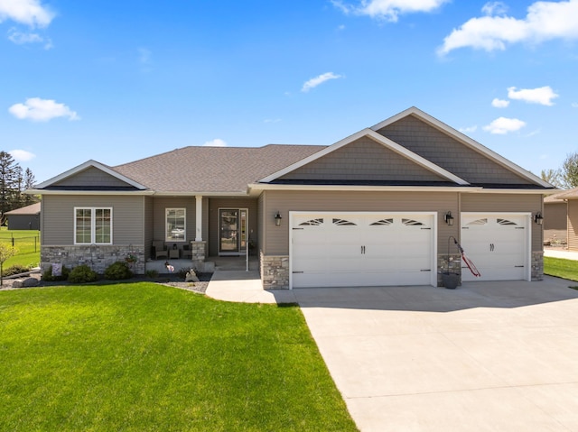2006 13th Ave NE, Austin, MN 55912 - craftsman-style house with stone siding, concrete driveway, and an attached garage