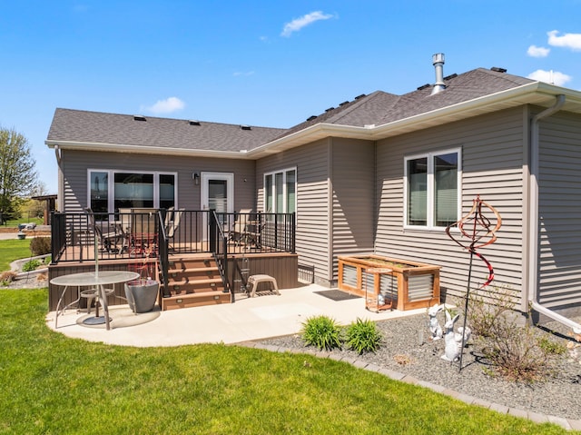 2006 13th Ave NE, Austin, MN 55912 - back of house featuring a patio area, a lawn, and a wooden deck