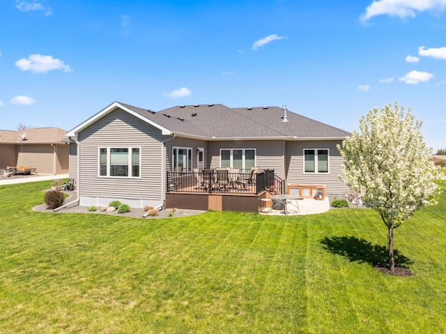 2006 13th Ave NE, Austin, MN 55912 - back of house with a patio area, a lawn, and a shingled roof