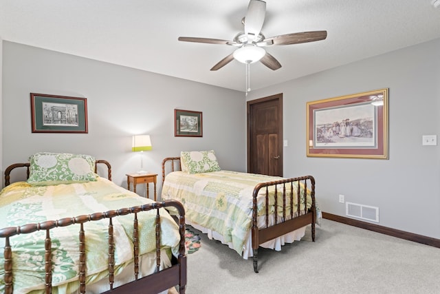 2006 13th Ave NE, Austin, MN 55912 - carpeted bedroom featuring baseboards and ceiling fan
