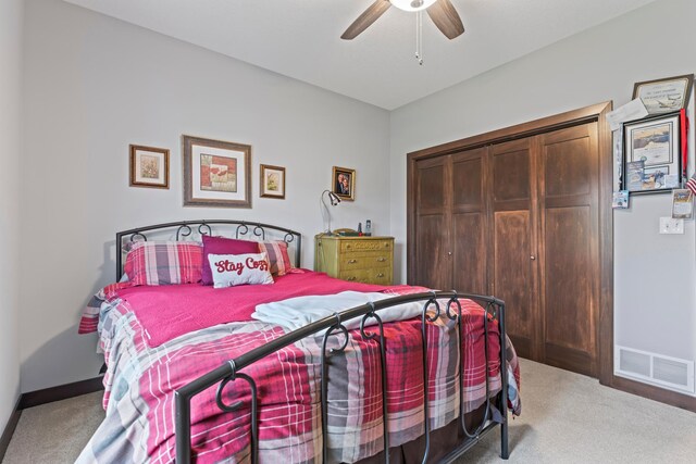 2006 13th Ave NE, Austin, MN 55912 - carpeted bedroom with a closet, baseboards, and a ceiling fan
