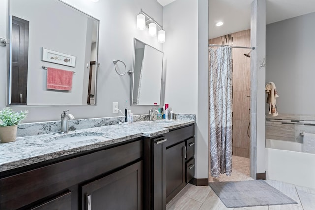 2006 13th Ave NE, Austin, MN 55912 - bathroom with a tile shower, double vanity, a garden tub, and tile patterned flooring