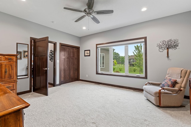 2006 13th Ave NE, Austin, MN 55912 - sitting room with light carpet, ceiling fan, baseboards, and recessed lighting