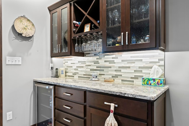 2006 13th Ave NE, Austin, MN 55912 - indoor dry bar featuring beverage cooler and decorative backsplash