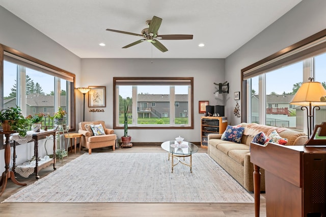 2006 13th Ave NE, Austin, MN 55912 - living room with healthy amount of natural light, wood finished floors, ceiling fan, and recessed lighting