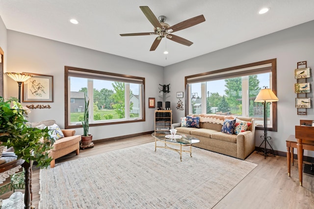2006 13th Ave NE, Austin, MN 55912 - living area with healthy amount of natural light, baseboards, light wood finished floors, and recessed lighting