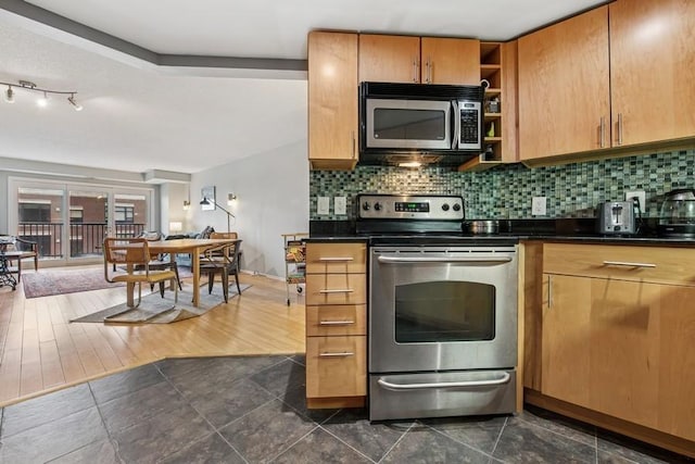 kitchen featuring appliances with stainless steel finishes, dark countertops, open shelves, and backsplash