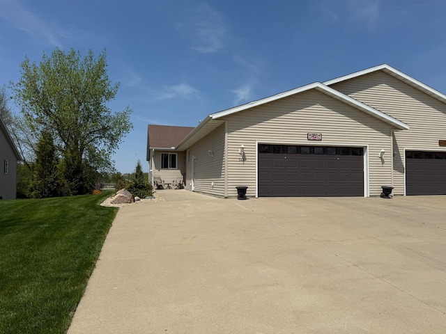 522 Delaware St SW, Lonsdale, MN 55046 - view of front of home with an attached garage, driveway, and a front yard