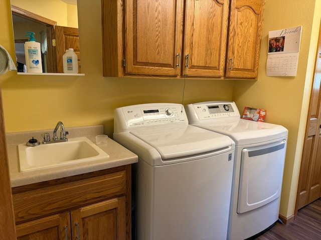 522 Delaware St SW, Lonsdale, MN 55046 - laundry area featuring cabinet space, washing machine and clothes dryer, and dark wood-style floors