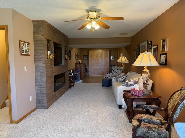 522 Delaware St SW, Lonsdale, MN 55046 - living room featuring carpet, a ceiling fan, a brick fireplace, and baseboards
