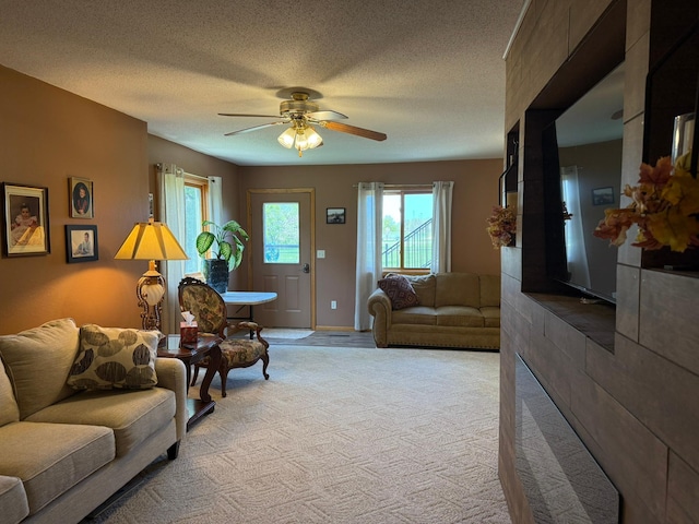 522 Delaware St SW, Lonsdale, MN 55046 - living room featuring a ceiling fan, light colored carpet, and a textured ceiling