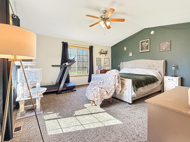 carpeted bedroom featuring lofted ceiling and ceiling fan
