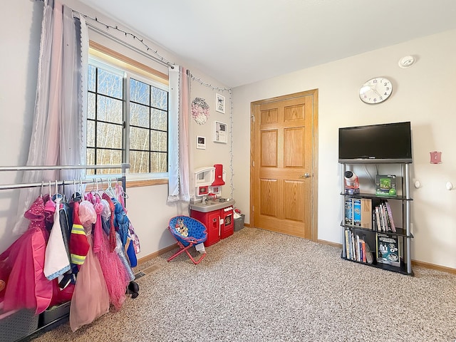 playroom featuring carpet flooring and baseboards
